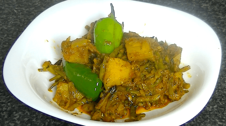 Aloo Mongray with potatoes and radish pods cooked with spices in a traditional Pakistani and Indian style.