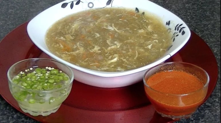 in a bowl Hot and Sour Soup Pakistani Style served with chili sauce – Cook With Faiza