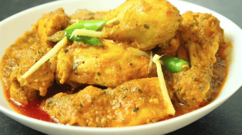 Authentic Peshawari Masala Murgh cooked with aromatic spices, served hot with naan and garnished with fresh coriander.