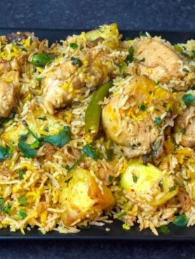 Chatpata Chicken Pulao served with raita and fried potatoes – Pakistani rice recipe