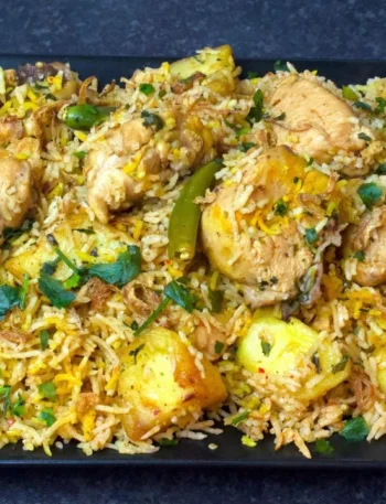 Chatpata Chicken Pulao served with raita and fried potatoes – Pakistani rice recipe